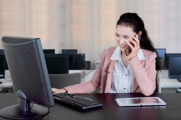 Businesswoman working with digital devices