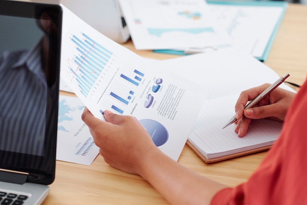 Businesswoman working with financial graphs