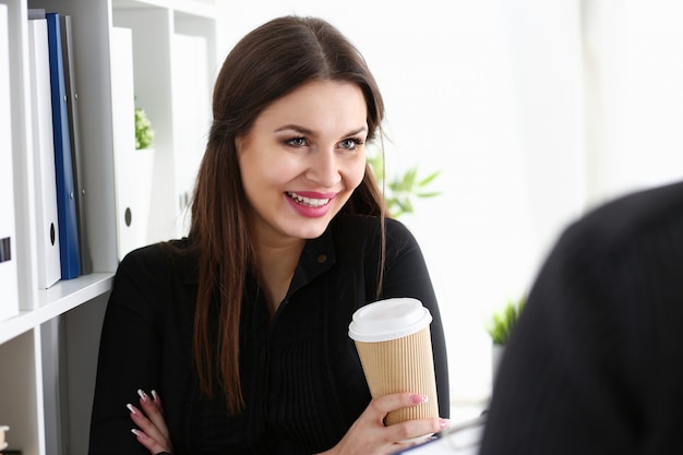 Businesswoman at workplace in office portrait