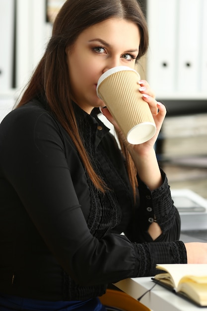 Businesswoman at workplace in office portrait