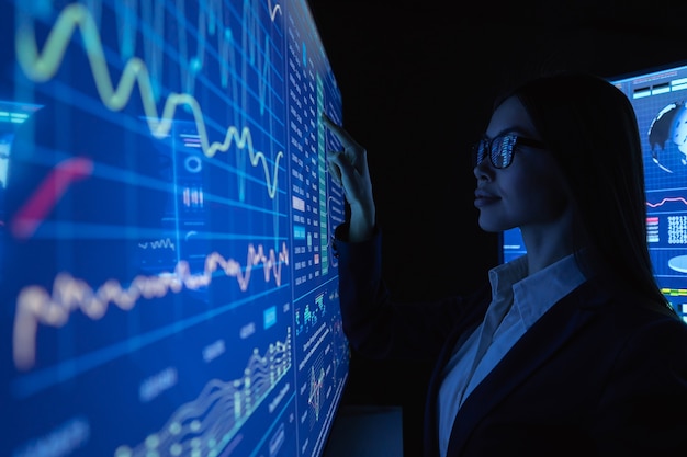 The businesswoman works with blue screen