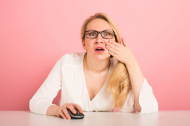 Businesswoman works with computer mouse