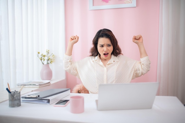 Businesswoman yawning while sitting in office