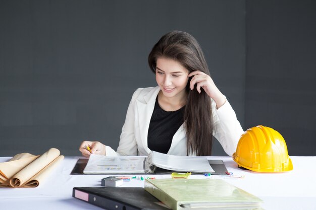 Businesswomen check business report.