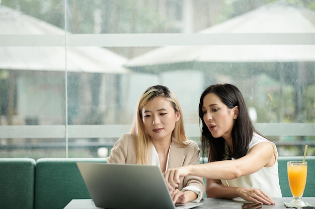 Businesswomen Discussing Product Presentation