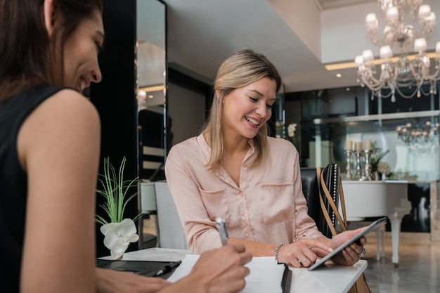 Businesswomen having a meeting in a hotel lobby