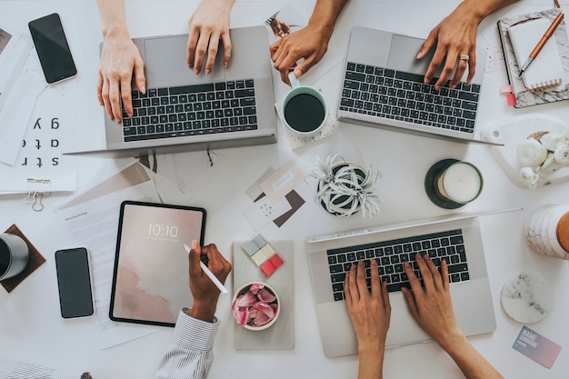 businesswomen using digital devices at work