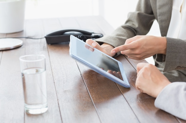 Businesswomen using tablet