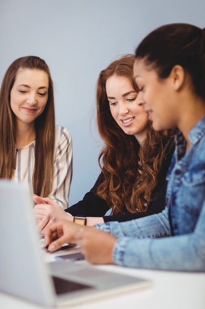 Businesswomen with laptop at desk