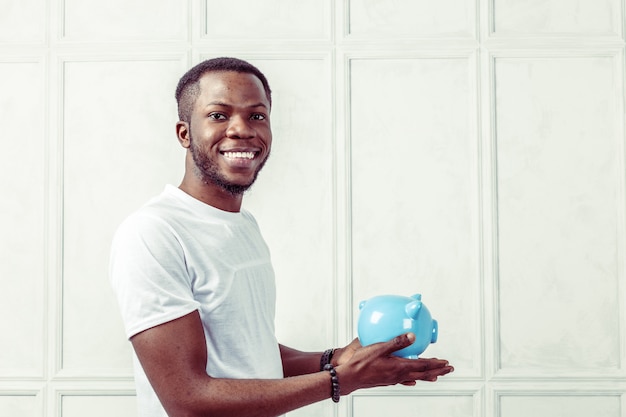 Businness black man with piggy bank