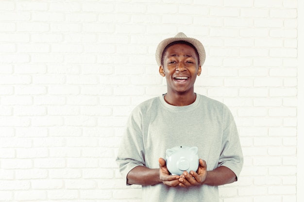 Businness black man with piggy bank