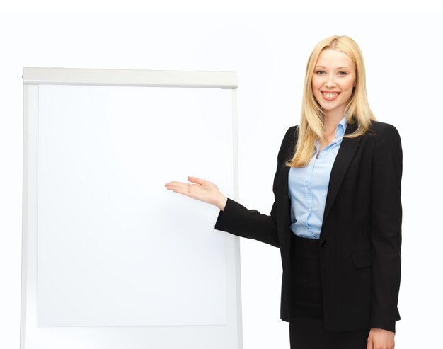 Photo bussiness and education - businesswoman with flipchart in office