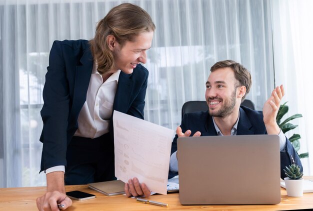 Busy analyst team in office analyzing financial data analysis Entity