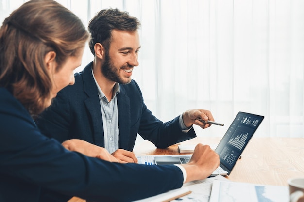 Busy analyst team in office analyzing financial data analysis Entity