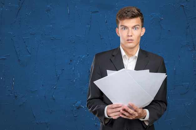 Busy businessman with loads of paperwork