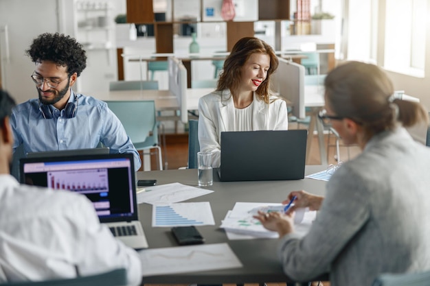 Busy coworkers cooperating and working together at office meeting teamwork concept