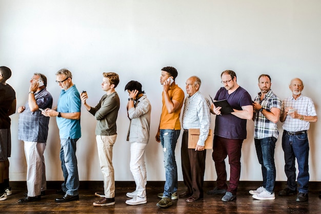 Busy diverse men standing in a line