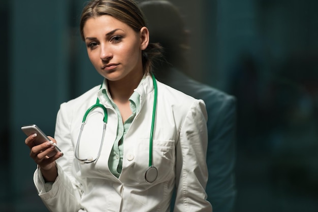 Busy Doctor Woman Texting On Her Cell Phone