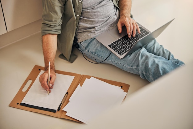 Busy gentleman working remotely from his home