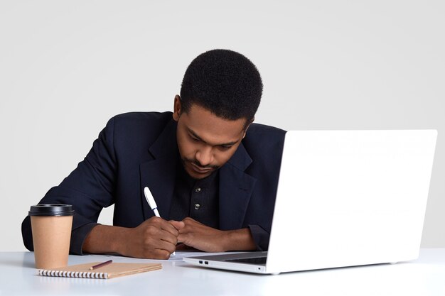 Busy male worker with dark healthy skin