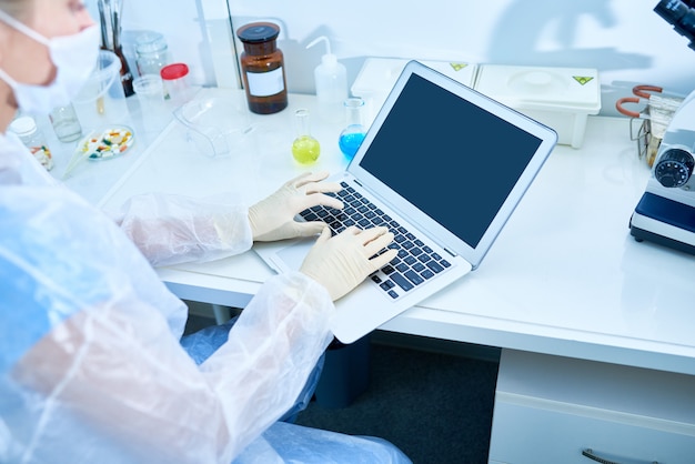 Busy researcher typing scientific article