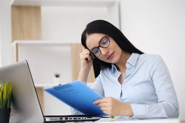 Busy woman making important notes