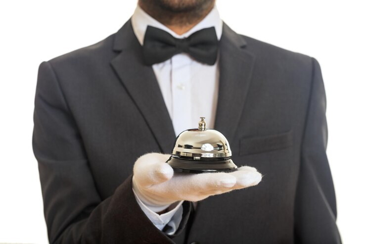 Photo butler service bell in a gloved hand
