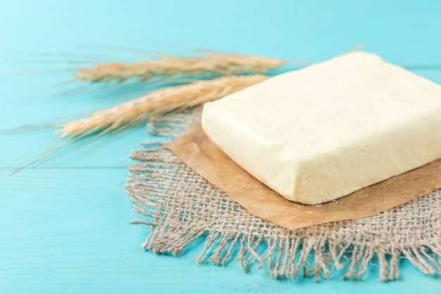 Butter on blue wooden table.