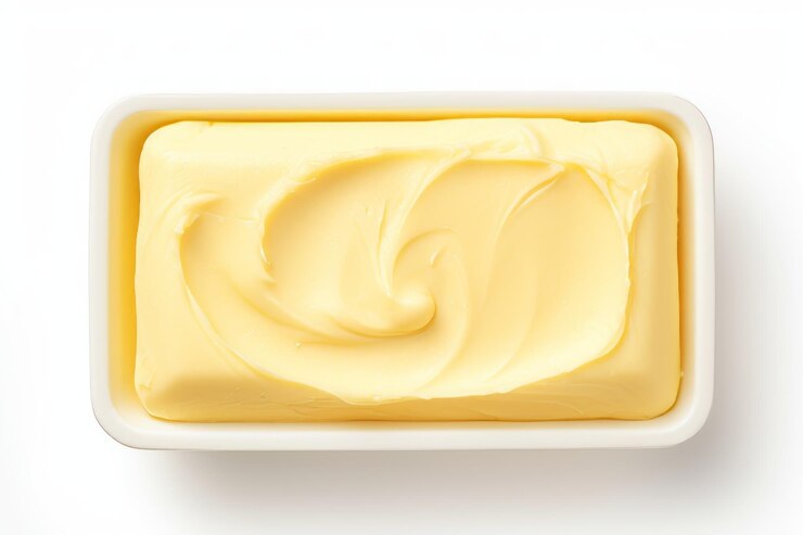 Butter A Delicious Top View Delight Isolated on a White Background