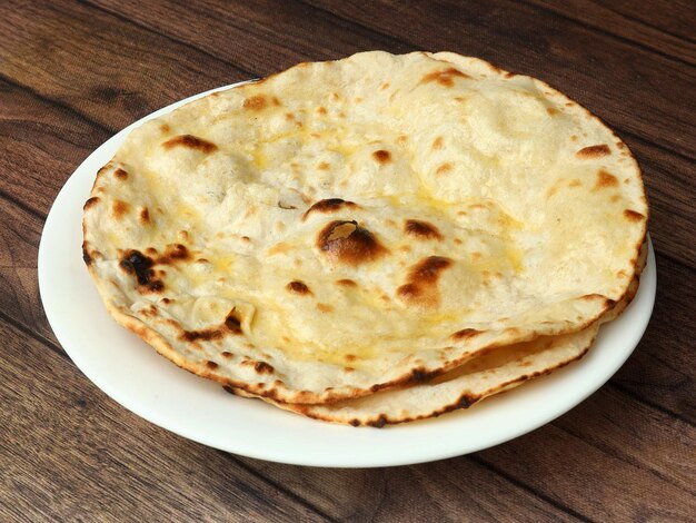 Butter roti isolated over a rustic wooden background selective focus