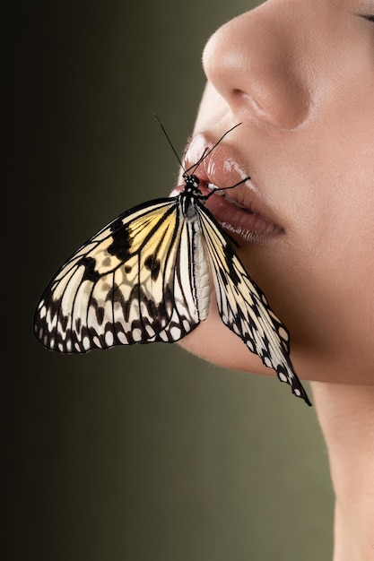 Butterfly on the girl face green background