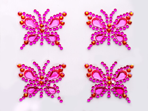 Butterfly symbols made of decorative gems isolated