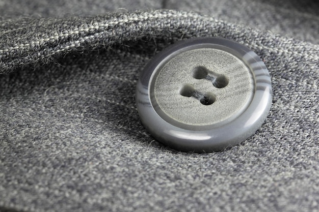 Button on a business suit with selective focus