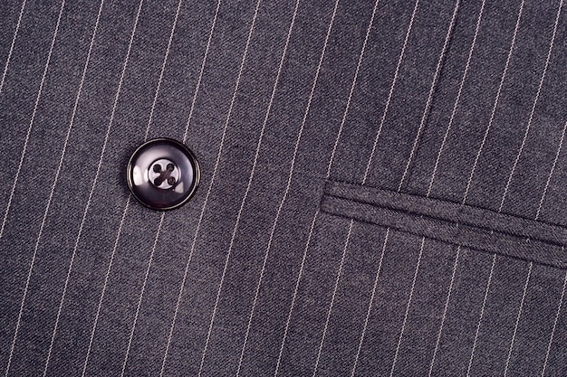 Photo button on pinstripe suit jacket