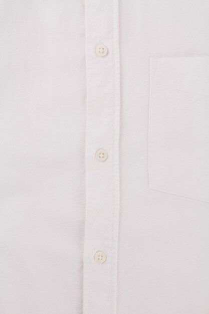 Button on a white men39s shirt close up