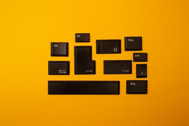 Photo buttons from a computer on a yellow background
