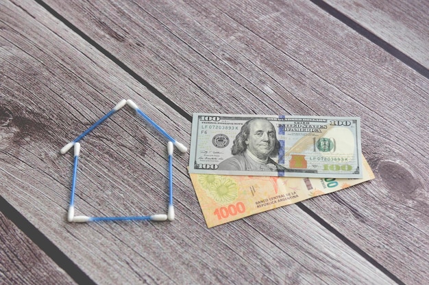 Buy a house saving concept in dollars