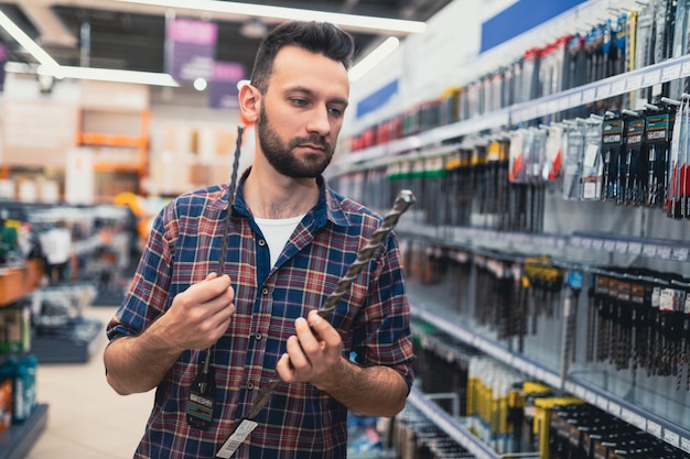 A buyer in a hardware store in the equipment department for a drill and a screwdriver chooses drills