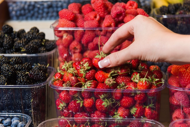 Buying berries in the local market