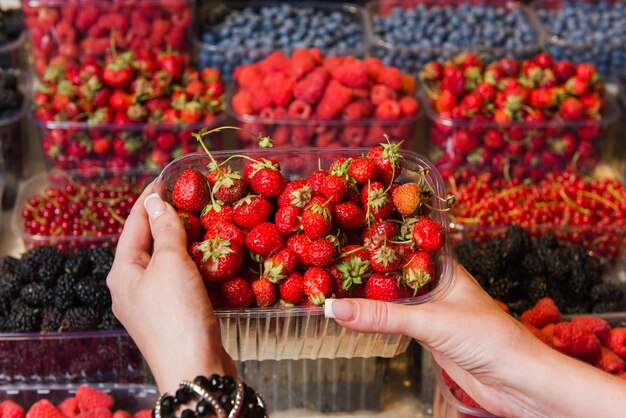 Buying berries in the local market