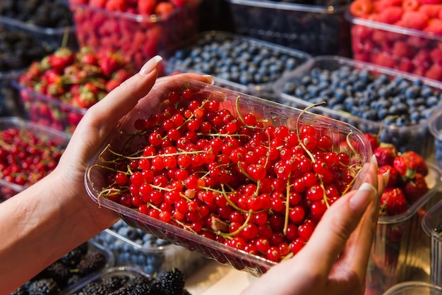 Buying berries in the local market