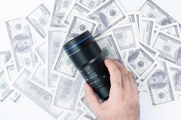 Photo buying a camera lens for money