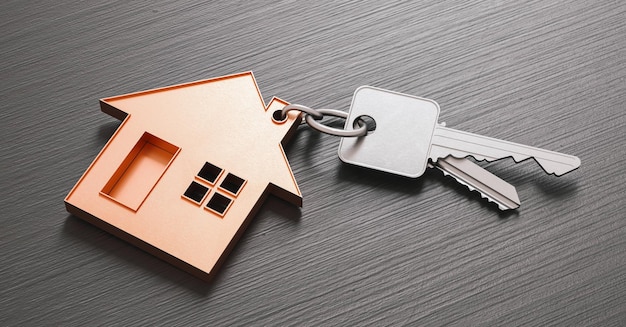 Buying a house with two home keys on a dark wooden background