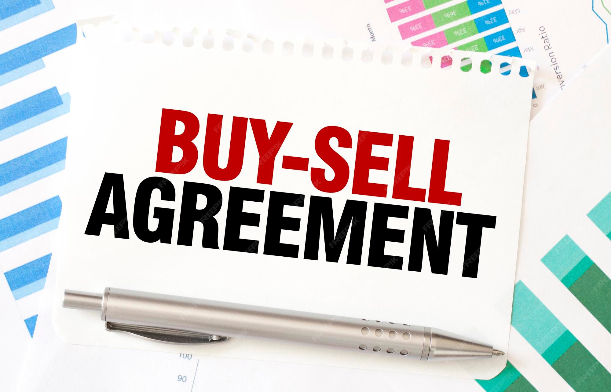 Premium photo buysell agreement on white paper sheet on charts