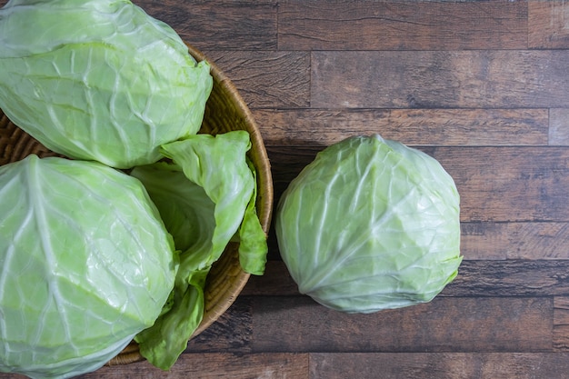 Cabbage in a basket on a wooden table