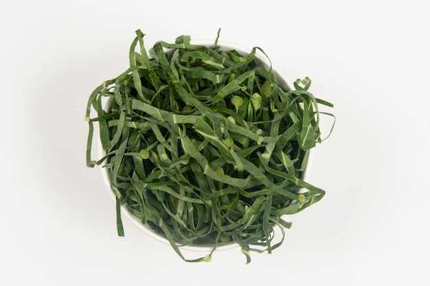 Cabbage chopped into strips in pot isolated