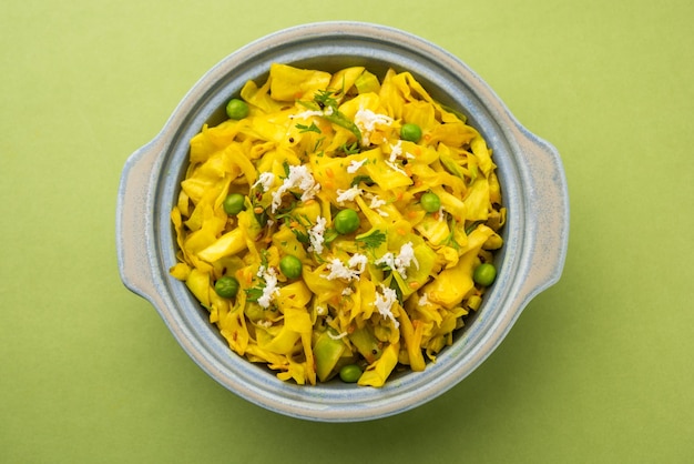 Cabbage coconut sabzi or vegetable with turmeric powder also known as patta gobi ki sabji, stir fried popular Indian food