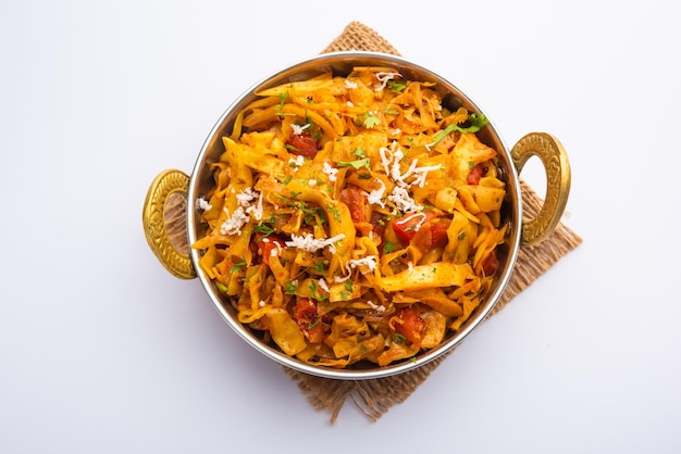 Cabbage coconut sabzi or vegetable with turmeric powder also known as patta gobi ki sabji, stir fried popular Indian food