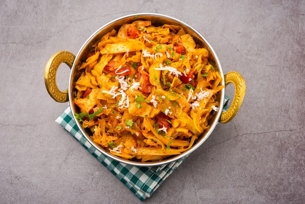 Cabbage coconut sabzi or vegetable with turmeric powder also known as patta gobi ki sabji, stir fried popular indian food