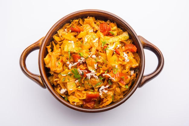 Cabbage coconut sabzi or vegetable with turmeric powder also known as patta gobi ki sabji, stir fried popular Indian food